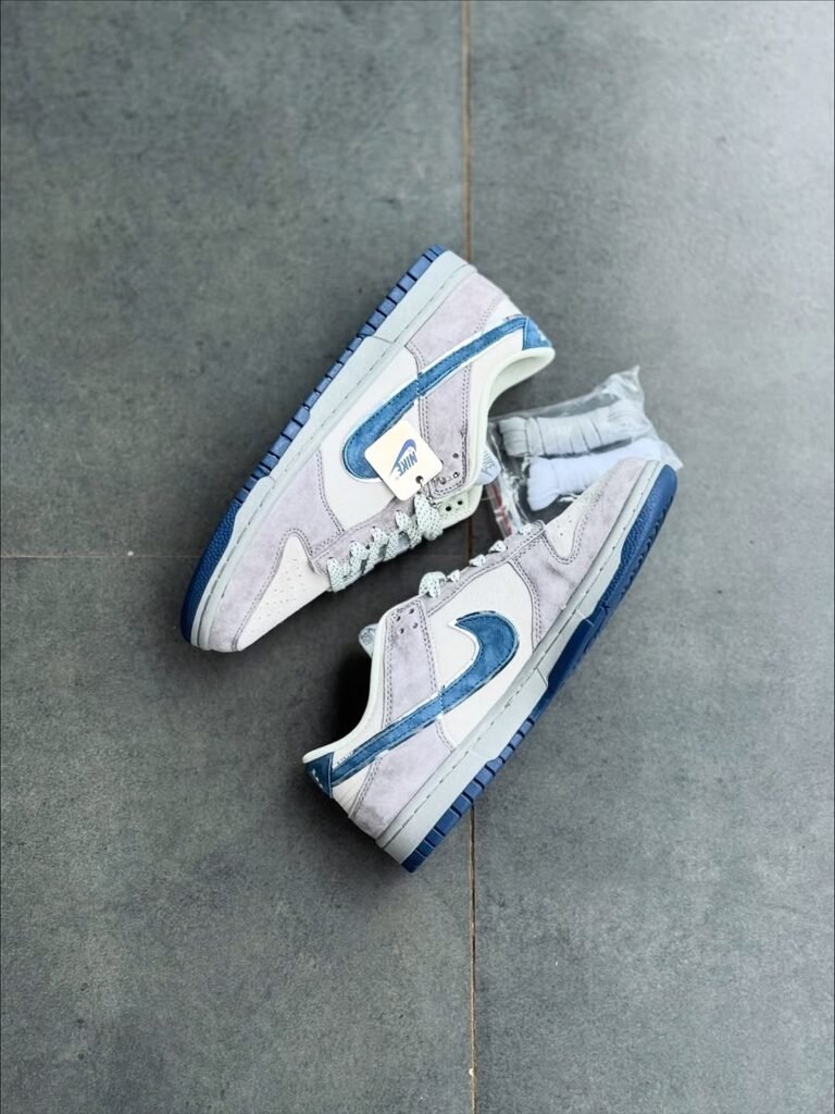 Classic Nike Dunk in light blue and grey suede, featured at the best shoe store in Malappura