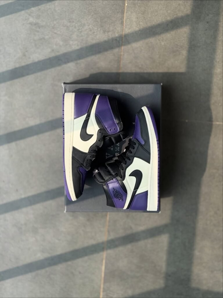 Iconic Nike Air Jordan 1 High in deep blue and white leather at the best shoe store in Malappuram.