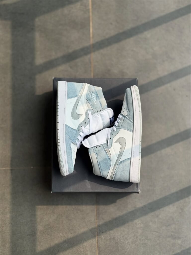 Nike Air Jordan 1 High in a textured grey and white colorway from the best shoe store in Malappuram.