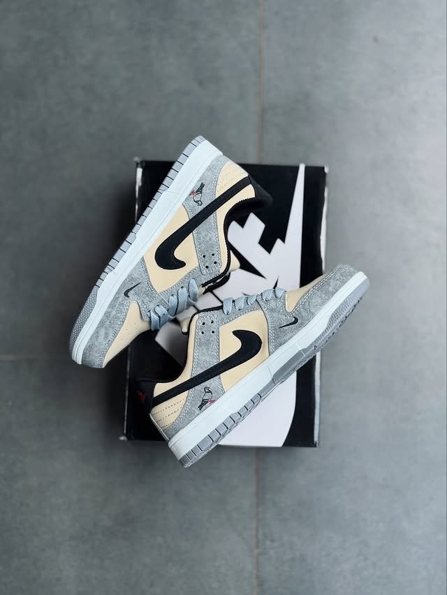 Nike performance running shoe in grey with blue accents, available at the best shoe store in Malappuram.