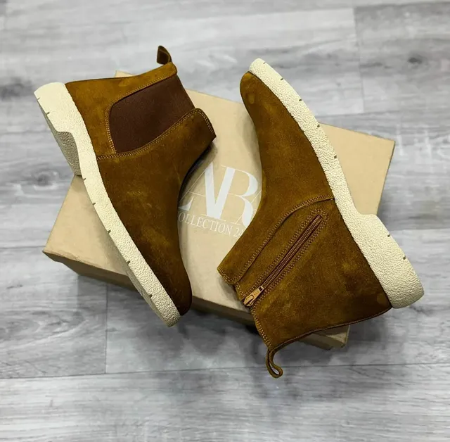 "Premium Men’s Formal Footwear in Vengara – brown suede ankle boots on a shoebox."