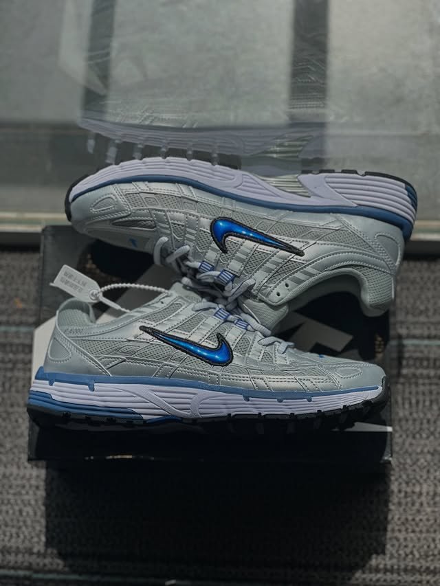 Nike SB Dunk Low in tan and grey earth tones, premium quality from the best shoe store in Malappuram.